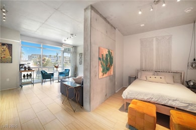 Bedroom featuring rail lighting