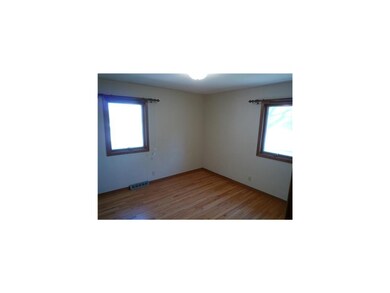 Bedroom. Beautiful hardwood floors and large windo