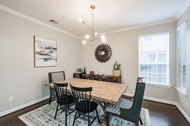Contemporary color palette and windows on two sides of this room make for a wonderful space in which to enjoy family Holiday dinners or entertaining friends.