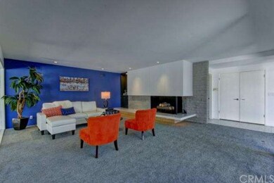 Giant living room has entire fireplace wall with c