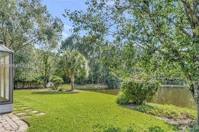 Private lot framed by wooded lagoon