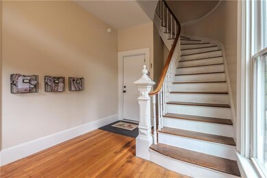 Graceful curving staircase.