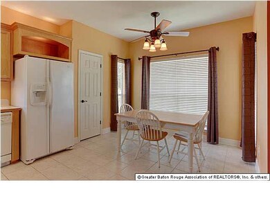Spacious living area with a corner wood burning fi
