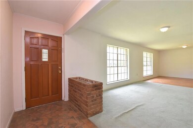 ENTRANCE FOYER OPENS TO LIVING/DINING ROOM