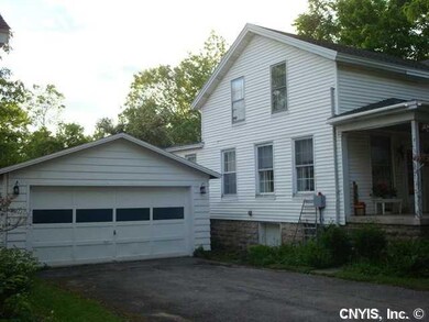 Exterior Front. Garage with opener off paved drive