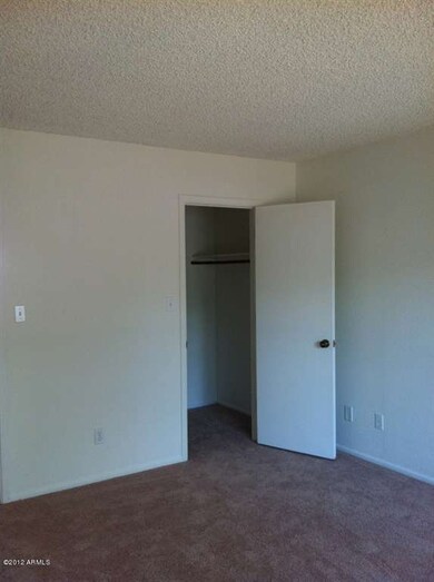 master bedroom with walk-in closet