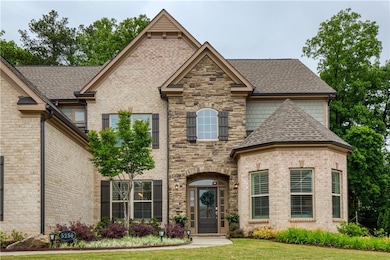 Beautiful brick and stone exterior with lush lands
