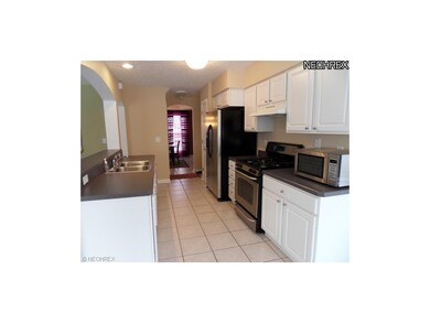 Open to the great room is the kitchen with ample c