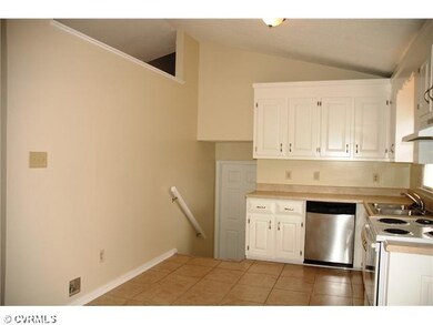 Kitchen - Kitchen with vaulted ceiling & stairway 