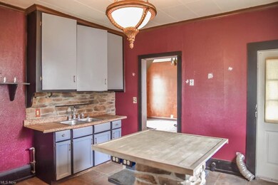 Kitchen with stone backsplash.