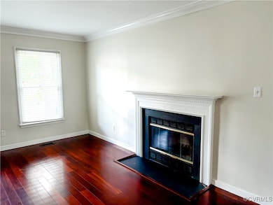 Detailed view of a glass covered fireplace, wood f