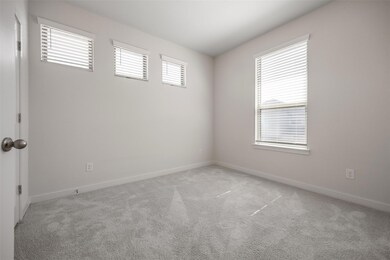 Spare room with carpet floors and baseboards
