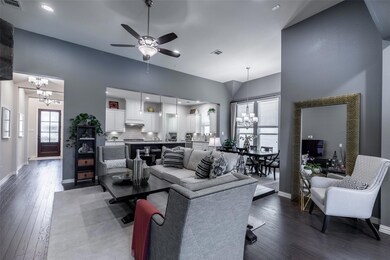 Living room featuring ceiling fan with notable cha