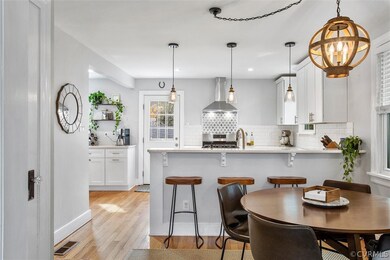 Gorgeous and updated eat-in kitchen with hardwood floors, recessed & pendant lighting.  Renovated in 2019.