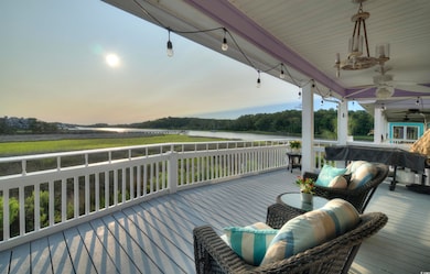 Wooden terrace featuring ceiling fan
