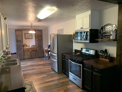 Great updated kitchen with new flooring, custom counter tops and stainless appliances