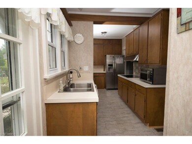 Kitchen has custom cabinets with ample cupboard sp