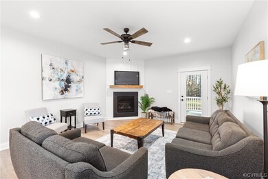 Living room with light hardwood / wood-style floor