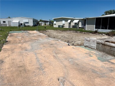South Side of lot with carport area.