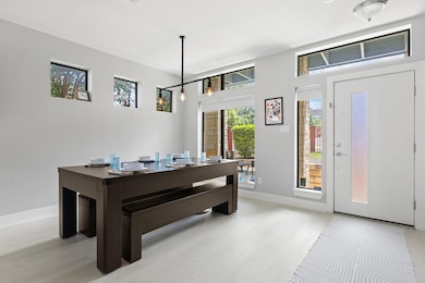 Dining space with light wood-style floors
