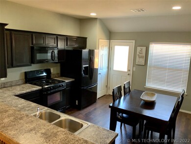 Eat in kitchen with pantry & access to back yard.