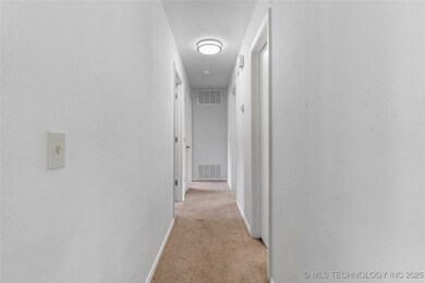 Entry hallway to home with bright white paint.