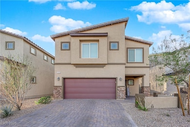 View of front facade featuring driveway, stucco si