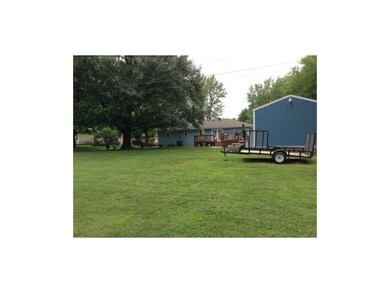 BACK OF THE HOUSE AND HUGE OUTBUILDING