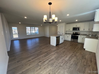 Kitchen with appliances with stainless steel finis