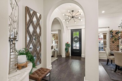 Entrance foyer featuring dark wood-style floors, a