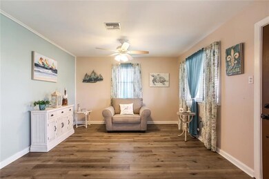 Living room, all window coverings remain.