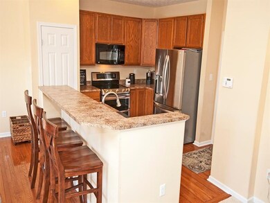 OPEN KITCHEN WITH LARGE ISLAND, NEWER STOVE WITH D