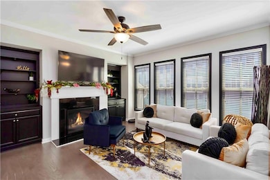 Living area with wood finished floors, a ceiling f