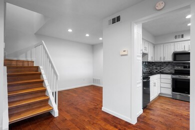 Kitchen with dark countertops, visible vents, and 