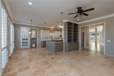 Kitchen featuring visible vents, crown molding, op