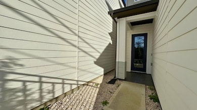 Sidewalk up to the door creates privacy.