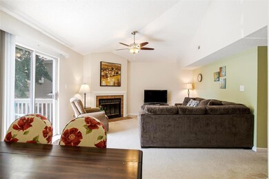 Light-filled living room with wood-burning firepla