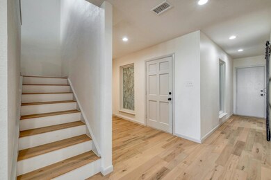 Foyer entrance featuring recessed lighting, light