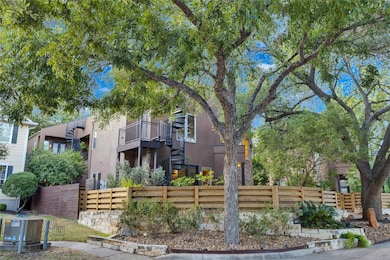 View of front of house featuring stairs and stucc