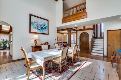 Dining area featuring baseboards, arched walkways,