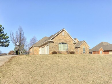 Traditional home with brick siding, a front yard, 