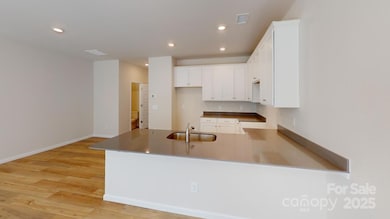 Photos are representational only. - Kitchen and dining space