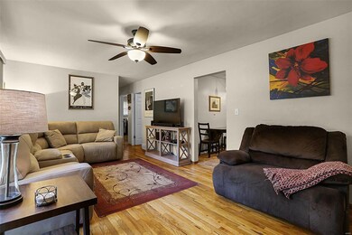 Spacious living room with wood floors.