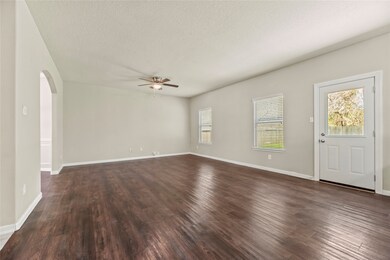 Large family room offers laminate flooring, ceilin