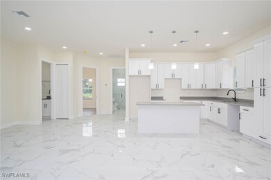 Kitchen featuring sink, pendant lighting, a kitche