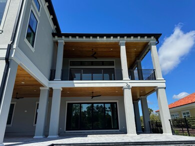 Exterior space with a balcony and ceiling fan