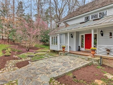 Welcoming entrance with slate walk, tulip tree and