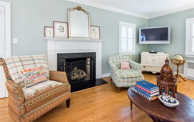 Notice the gas logs, plantation shutters and gorgeous hardwoods!