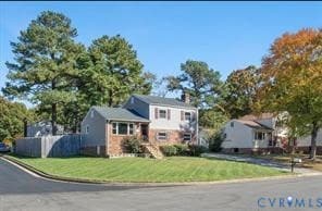 Tri-level home featuring a chimney