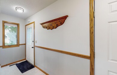 Entry to the Foyer is just off of the kitchen. You can access from the outside or the garage.